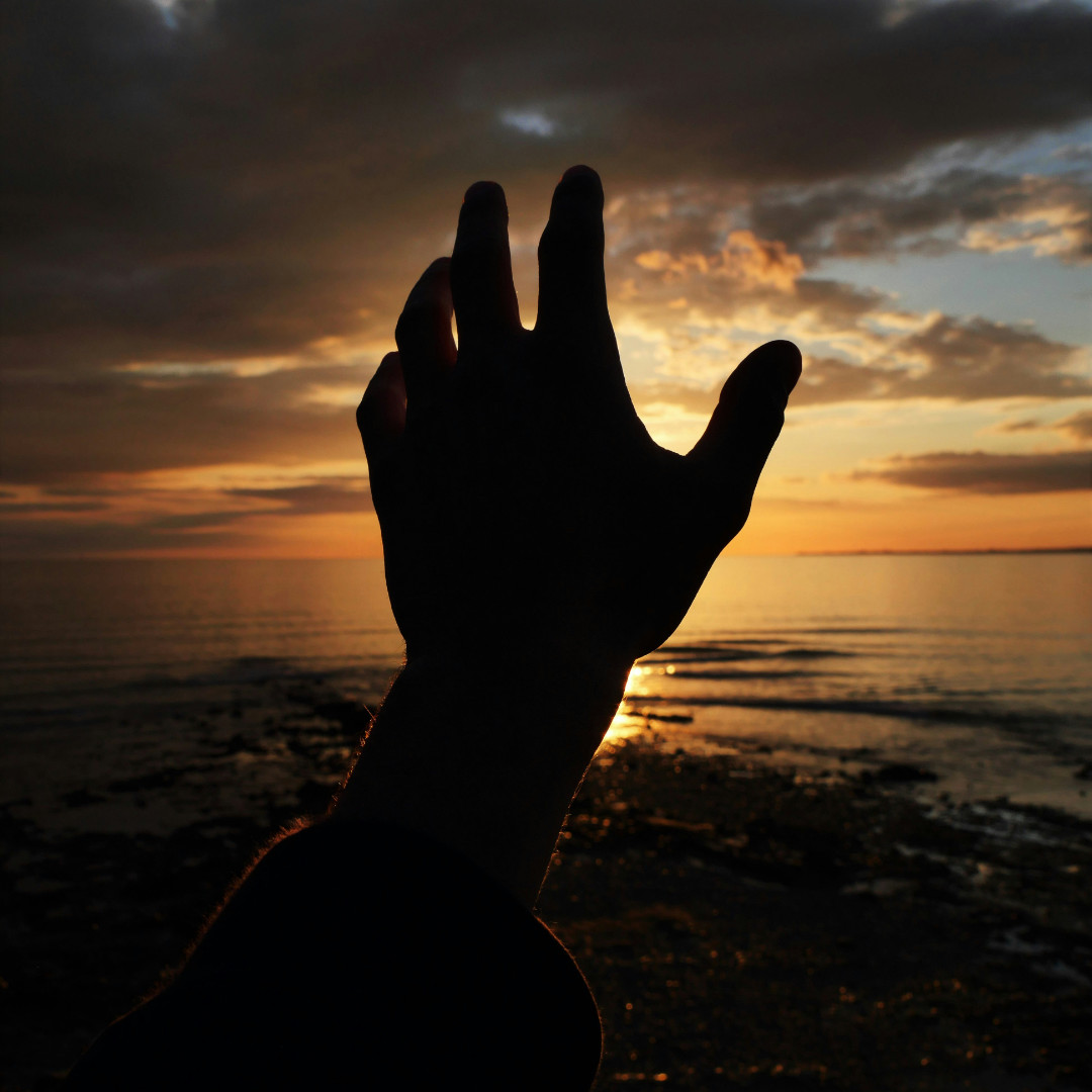 A person walking into bright morning sunlight representing the decision of faith
